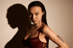 maxincarroll — burgundy bra and oiled body