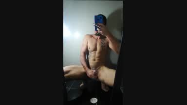 cum jack in the bathroom looking into the mirror