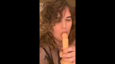 Sucking a dildo