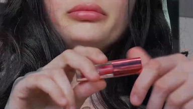 putting lipstick on
