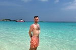 in shorts on the beach