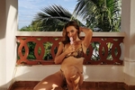 In a bikini on the balcony