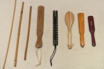 the paddle, the brush, the strap and the cane