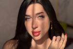 her huge eyes and lips shine in the sun