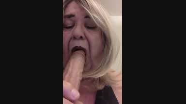 Geri sucks and deep throats a dildo.