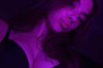 Black bra in purple light