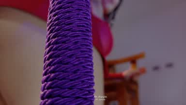 Whipping with a purple flogger