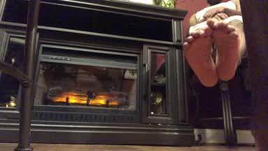 Feet by the fireplace