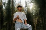 a sensual man in the forest