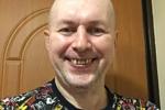 Shaved bald, smiling and surprised