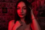 in the red light of the lamp