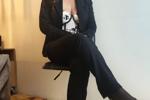 Lady in a black suit… and what she hides underneat