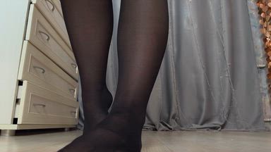 showing legs in 40 den tights on a naked body