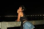 Sexy girl with thick thighs on the pier at night