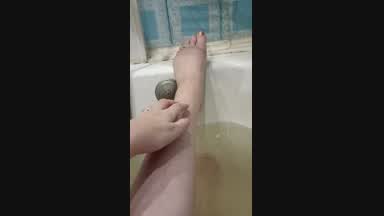 I caress my feet in the bathroom
