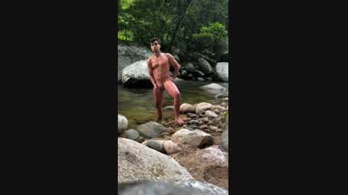 Cumshot by the waterfall