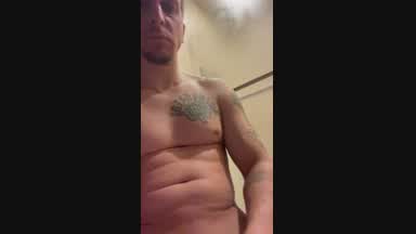 My man stroking his big fat dick for me