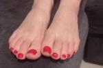 Feet with red toenails