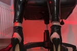 In latex leggings and high heels