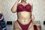 In burgundy lingerie