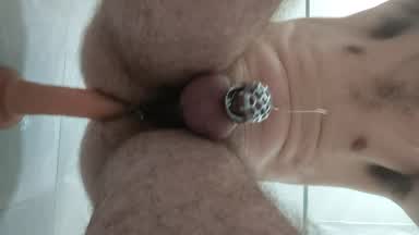 Dildo fucking and cum in cage