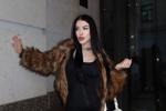 wearing a fur coat