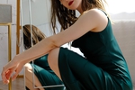 seductive and captivating in this emerald dress
