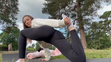 YOGA STRETCHING out on the street