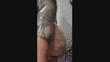 Sarah gets a shower and fucks ass with big dildo