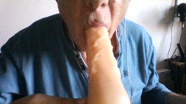 Gagging on a dildo