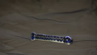 ANAL glass toy close up