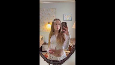 Bow coquette teases in the mirror