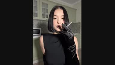 Cigarette, brunette and black gloves