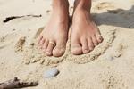 Feet ring in beach sand