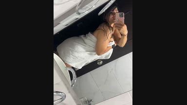 Jenn flirting in front of the mirror