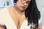 Black curls and sexy glasses an irresistible comb