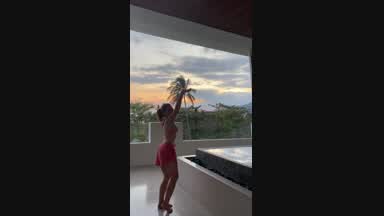 Analia dancing and taking some clothes off