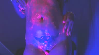 Erotic dance with neon paint