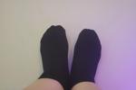 stella — feet in black sneaker socks