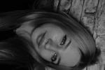 Grimacing a little