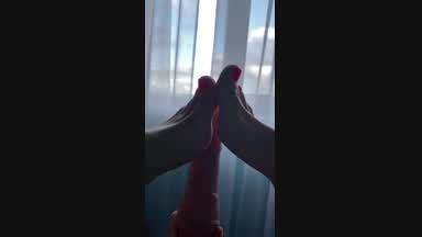 I caress my feet with a dildo