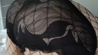 Bent over in fishnets