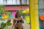 Wearing a black bikini