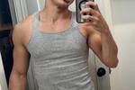 smiling :) wearing wife beater