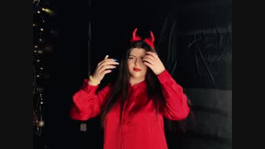 Christmas magic in a devil costume,