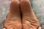 Wearing  jeans and showing my soles