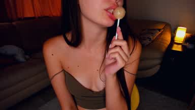pkay with a lolipop