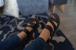 My feet in sandals with red nail polish - Lina