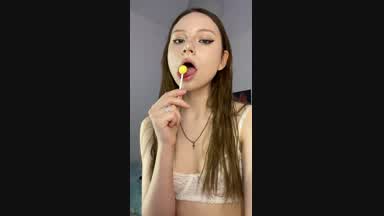Eating and licking lollipop