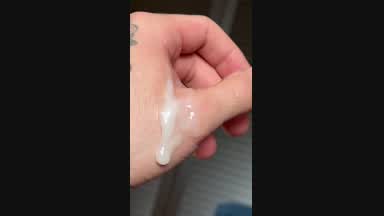 My cum slowly dropping from my hand